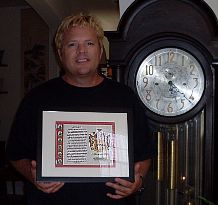 Freddy Stewart with his Birthday Gift of a Framed Stewart Family Crest Print
